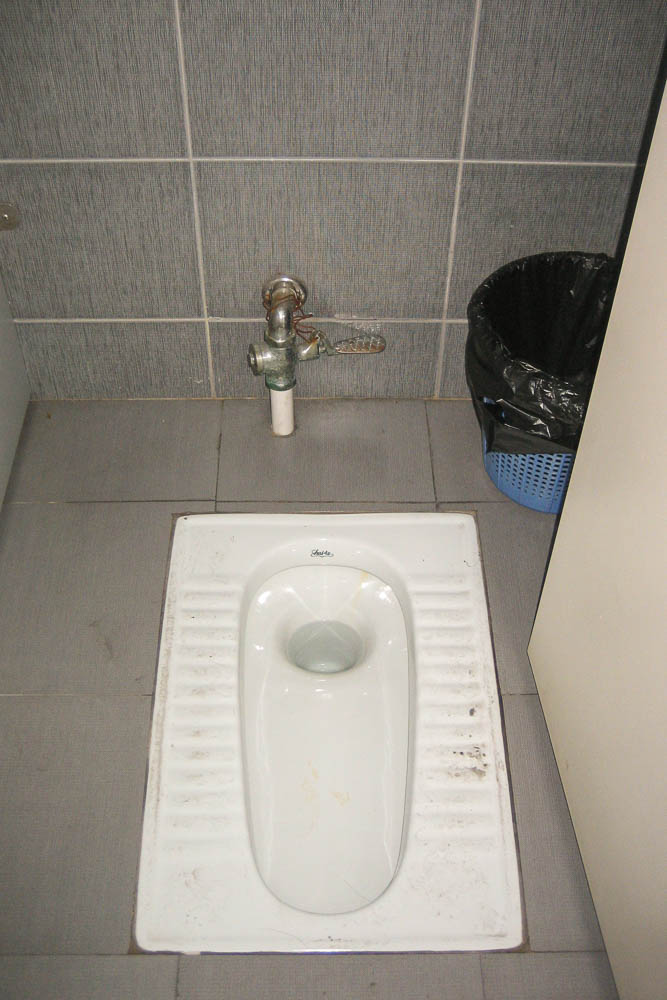 Squat style bathroom in China