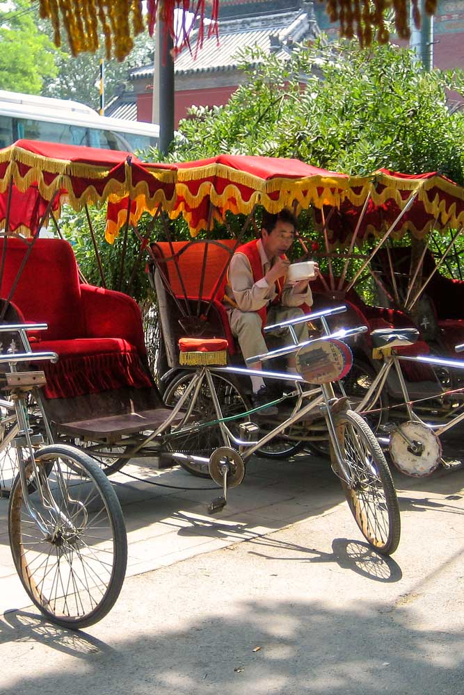A Chinese rickshaw driver in Beijing, China