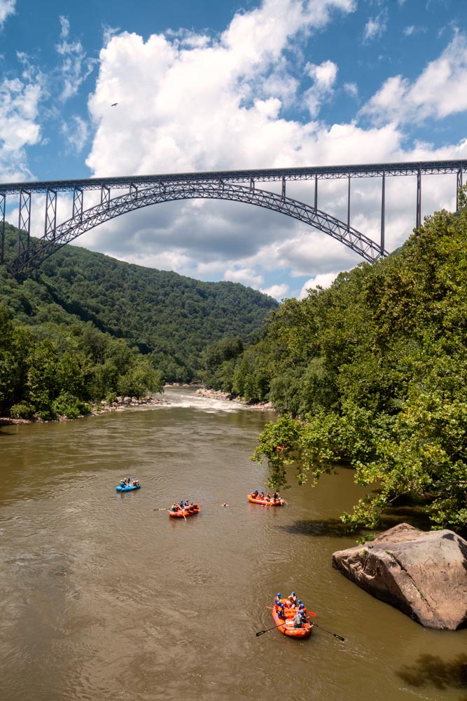 Water Rafting at New River Gorge in West Virginia with New River Gorge Bridge in the distance