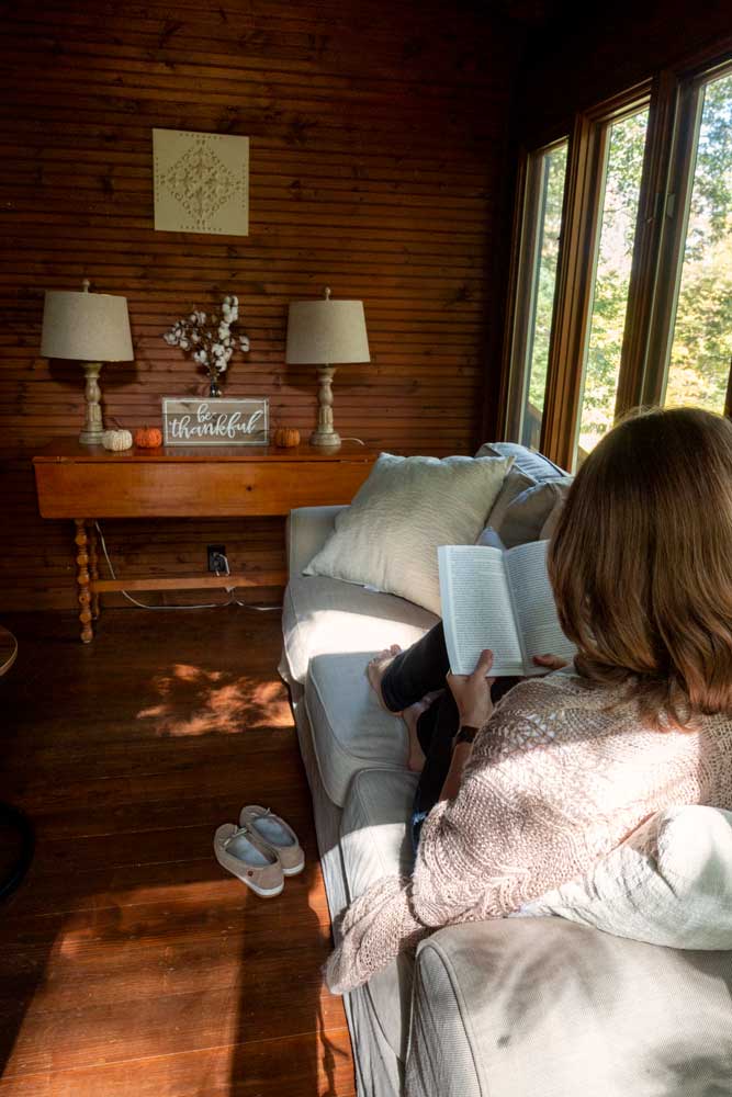 Reading a book at Cozy Pine Cabin in Brown County Indiana