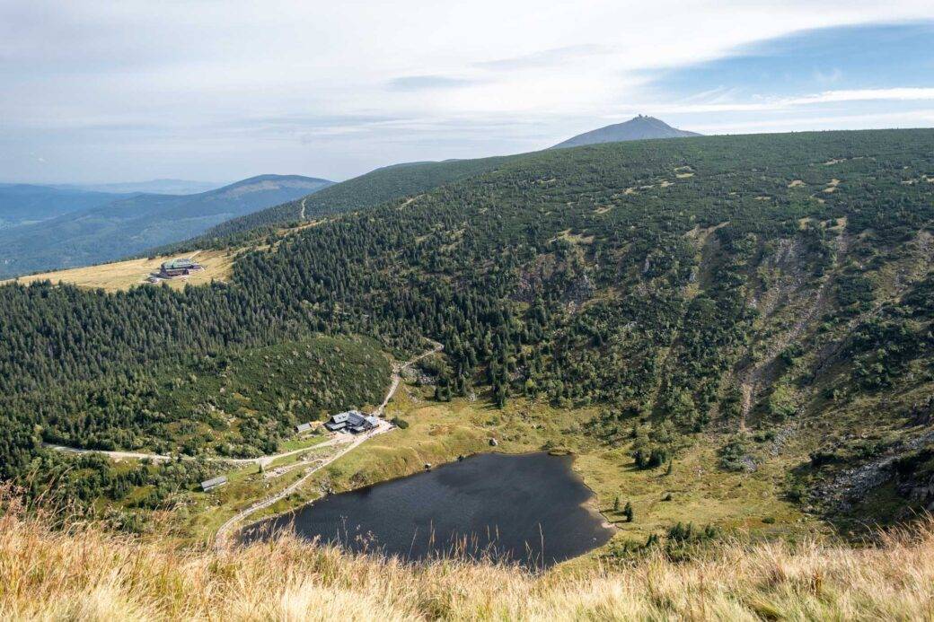 view of Śnieżka peak and mountain huts from the Red Trail in the Polish Karkonosze Mountains